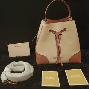 Michael Kors Hand/Shoulder Drawstring bag.